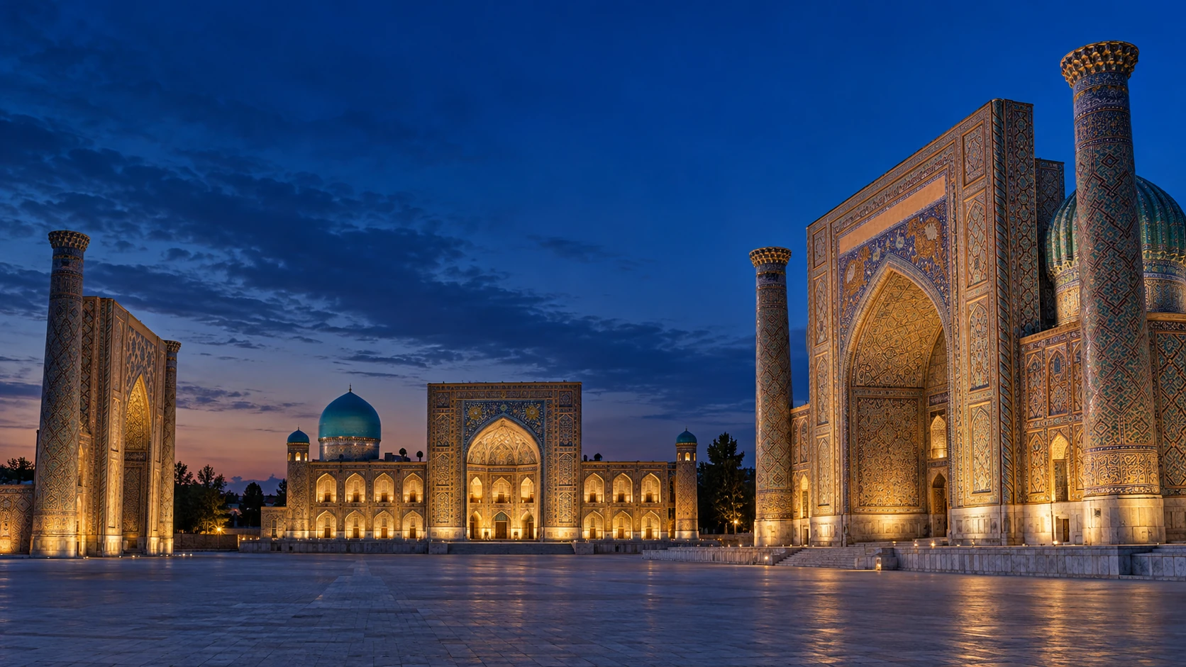 The illuminated madrasahs of Registan Square at blue hour